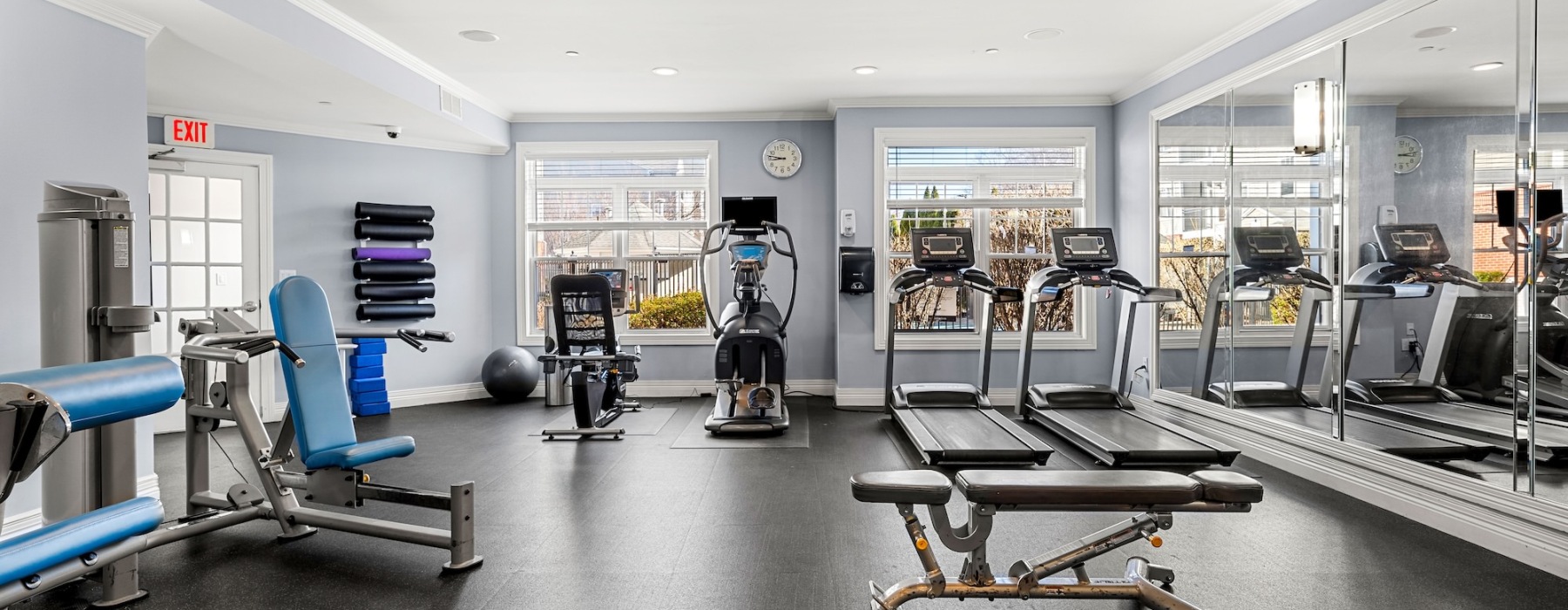 cardio and weight training stations in gym