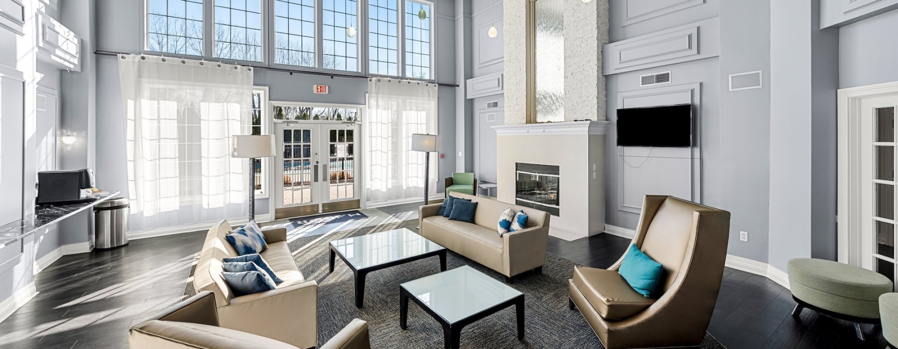 Beautiful clubroom with lounge seating and a TV