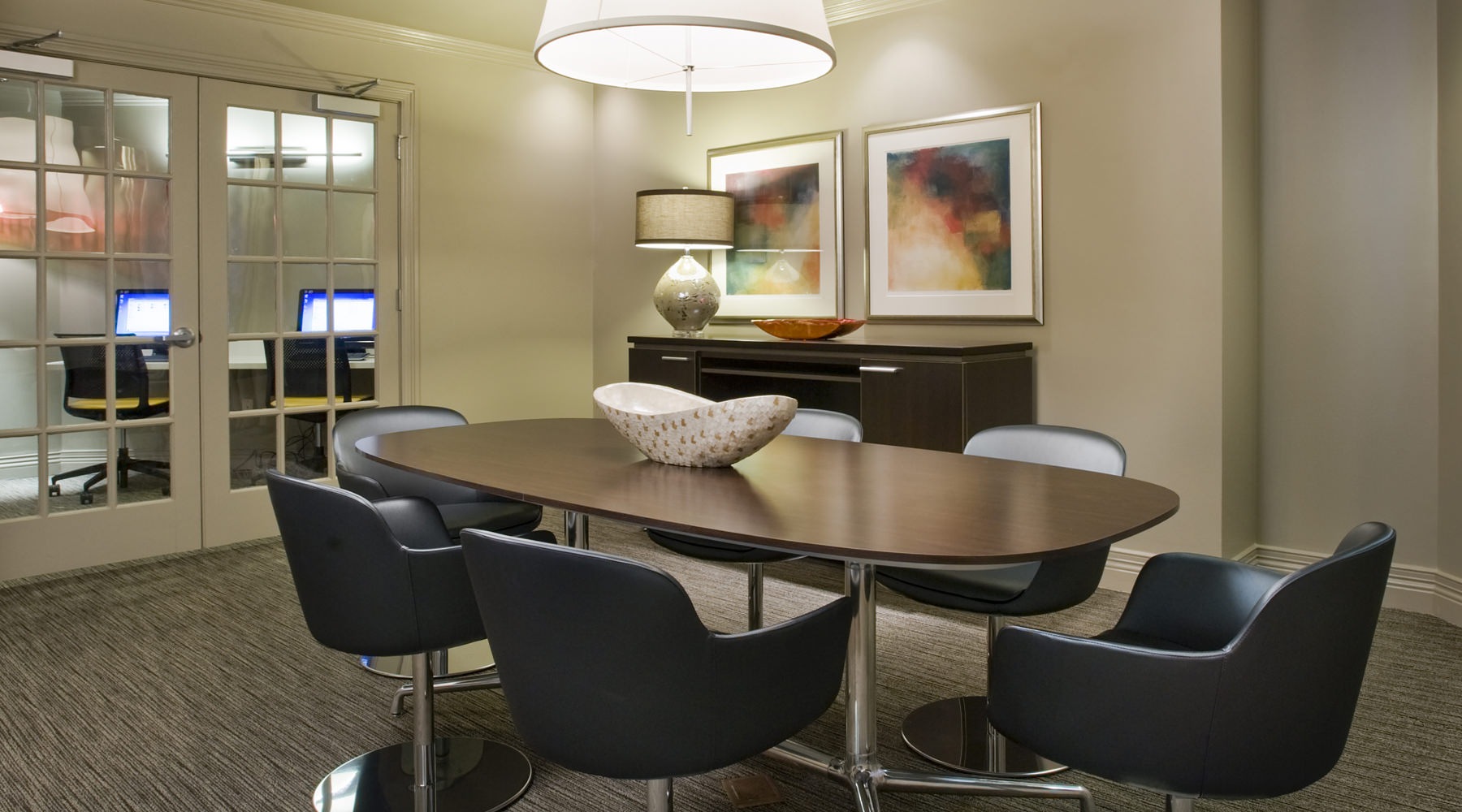 Conference room with large table and TV